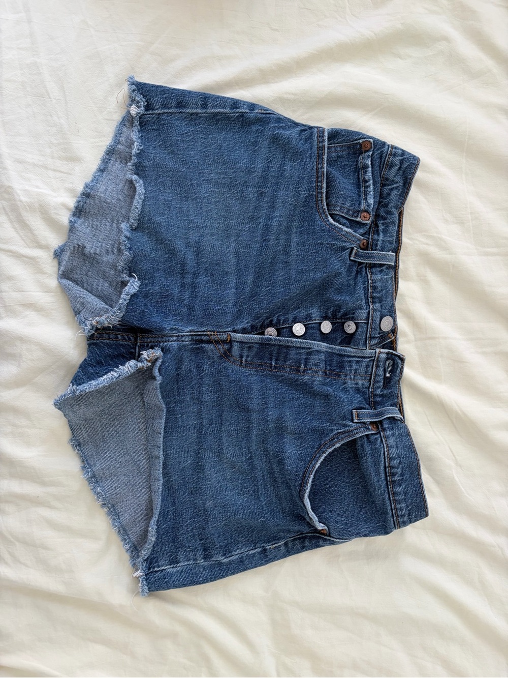 Levi's Raw Hem Medium Blue Button-Fly Denim Shorts